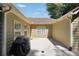 Back courtyard featuring wood siding, an enclosed wall, and concrete flooring at 5600 Walnut Creek Nw Ct, Lilburn, GA 30047