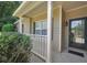 Inviting front porch with decorative columns and a stylish front door at 5600 Walnut Creek Nw Ct, Lilburn, GA 30047