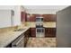 Spacious kitchen with granite countertops, stainless steel appliances, and ample storage at 5600 Walnut Creek Nw Ct, Lilburn, GA 30047