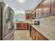 Well-equipped kitchen with stainless steel appliances, granite countertops, and tile backsplash at 5600 Walnut Creek Nw Ct, Lilburn, GA 30047