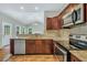 Inviting kitchen with stainless steel appliances, granite countertops, and stylish cabinetry at 5600 Walnut Creek Nw Ct, Lilburn, GA 30047