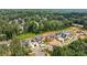 The aerial view reveals modern homes nestled in a leafy neighborhood, balancing luxury and nature at 225 River Valley Ct, Atlanta, GA 30328