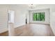 Spacious bedroom with shiplap walls, recessed lighting, hardwood floors, and large windows at 225 River Valley Ct, Atlanta, GA 30328
