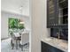 Dining room with modern chandelier, marble countertop, dark cabinets, and stainless faucet at 225 River Valley Ct, Atlanta, GA 30328