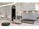 Close-up of kitchen with large island, stainless steel stove, marble backsplash and countertops at 225 River Valley Ct, Atlanta, GA 30328