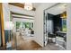Open-concept living space with hardwood floors, dark trim, and black paneled office at 225 River Valley Ct, Atlanta, GA 30328