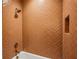 Luxurious shower featuring designer tilework, rainfall showerhead, and built-in niche for bath essentials at 225 River Valley Ct, Atlanta, GA 30328