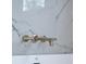 The brass tub faucet is wall-mounted on a marbled wall with modern finishes at 225 River Valley Ct, Atlanta, GA 30328