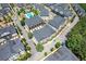 Aerial view of townhomes in a well-maintained community with a pool and mature trees at 3693 Allegretto Cir, Atlanta, GA 30339