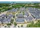 Community aerial view showcasing lush landscaping, townhome exteriors, and city views at 3693 Allegretto Cir, Atlanta, GA 30339