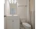 Neutral toned bathroom with a white single sink vanity and toilet at 3693 Allegretto Cir, Atlanta, GA 30339