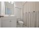 Well-lit bathroom with a stylish vanity, a toilet and a neutral shower curtain at 3693 Allegretto Cir, Atlanta, GA 30339