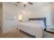 Serene bedroom with a grey upholstered headboard and white bedding near an ensuite bathroom at 3693 Allegretto Cir, Atlanta, GA 30339