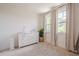 Comfortable Bedroom with a changing table, lush plant, and soft, neutral accents at 3693 Allegretto Cir, Atlanta, GA 30339
