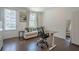 Home office with desk, seating area, full length mirror, and exterior access to bring in light at 3693 Allegretto Cir, Atlanta, GA 30339