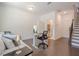 Versatile bonus room with space for work or relaxation, including a seating area and visible bathroom at 3693 Allegretto Cir, Atlanta, GA 30339