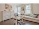 Functional home office offers a work space, seating area, and plenty of storage space and natural light at 3693 Allegretto Cir, Atlanta, GA 30339