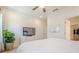 Bright bedroom with neutral tones, a ceiling fan, and a television above a dresser at 3693 Allegretto Cir, Atlanta, GA 30339