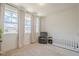 Bright Bedroom with a crib and large windows at 3693 Allegretto Cir, Atlanta, GA 30339