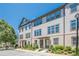 Charming townhome featuring a three-story layout, landscaped front yard and neutral color palette at 3693 Allegretto Cir, Atlanta, GA 30339