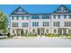Street view of charming three-story townhomes with well-maintained landscaping and inviting entrances at 3693 Allegretto Cir, Atlanta, GA 30339
