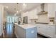 Bright kitchen with stainless steel appliances, pendant lighting, and an open floor plan at 3693 Allegretto Cir, Atlanta, GA 30339