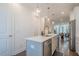 Spacious kitchen island with a stainless steel dishwasher and dining area in background at 3693 Allegretto Cir, Atlanta, GA 30339