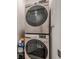 Modern, front-load washer and dryer, stacked for convenience in the laundry area at 3693 Allegretto Cir, Atlanta, GA 30339