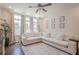 Cozy living area with a large sectional sofa, bright windows, and dark wood flooring at 3693 Allegretto Cir, Atlanta, GA 30339