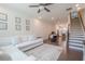 Cozy living room with an open layout, comfortable sofa, and stairway to the second floor at 3693 Allegretto Cir, Atlanta, GA 30339