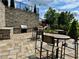 Outdoor kitchen with grill and dining area, perfect for entertaining guests with outdoor seating at 3693 Allegretto Cir, Atlanta, GA 30339