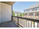 View from a spacious patio that overlooks the street and other townhomes in the community at 3693 Allegretto Cir, Atlanta, GA 30339