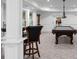 Basement with a pool table and carpeting plus bar seating area in this home at 8805 Marion Dr, Duluth, GA 30097