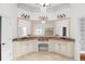 Bathroom with dual sinks, granite counters, custom mirrors and sconces, plus white cabinetry and tile floor at 8805 Marion Dr, Duluth, GA 30097