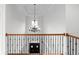 Elegant foyer features a decorative chandelier and hardwood floors, creating a grand entrance at 8805 Marion Dr, Duluth, GA 30097