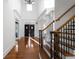 Grand foyer featuring hardwood floors, staircase, and a view of the double front doors at 8805 Marion Dr, Duluth, GA 30097