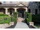 Elegant front entrance featuring a stone facade, brick walkway, and manicured greenery at 8805 Marion Dr, Duluth, GA 30097