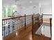 Second story hallway with hardwood floors and a chandelier at 8805 Marion Dr, Duluth, GA 30097