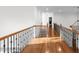 Hallway featuring hardwood floors and decorative railing at 8805 Marion Dr, Duluth, GA 30097