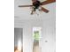 Hallway featuring neutral walls, ceiling fan, and multiple doorways leading to various rooms at 8805 Marion Dr, Duluth, GA 30097