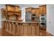 A gourmet kitchen features custom wood cabinetry, a large kitchen island, and stainless steel appliances at 8805 Marion Dr, Duluth, GA 30097