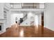 Spacious living room features a fireplace, built-in shelves, stairs, and decorative columns at 8805 Marion Dr, Duluth, GA 30097