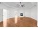 Open living room with hardwood floors, fireplace, and neutral walls at 8805 Marion Dr, Duluth, GA 30097