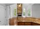 Open floor plan showing eat in kitchen with stone fireplace, and a vaulted ceiling at 8805 Marion Dr, Duluth, GA 30097