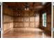 An office with hardwood floors, wood-paneled walls, ceiling trim, and a ceiling fan at 8805 Marion Dr, Duluth, GA 30097