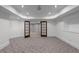 Carpeted room with neutral walls, french doors and recessed lighting at 8805 Marion Dr, Duluth, GA 30097