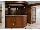 Basement wet bar with a granite countertop, pendant lighting, and wood cabinetry at 8805 Marion Dr, Duluth, GA 30097