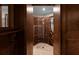 Wine cellar with an organized rack system for storing bottles and travertine flooring at 8805 Marion Dr, Duluth, GA 30097
