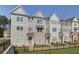Charming townhome community featuring well-manicured lawns and stylish architectural details at 3348 Cranston Ln, Kennesaw, GA 30144