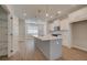 Spacious kitchen with a large center island, stainless steel appliances, and white cabinets at 3348 Cranston Ln, Kennesaw, GA 30144